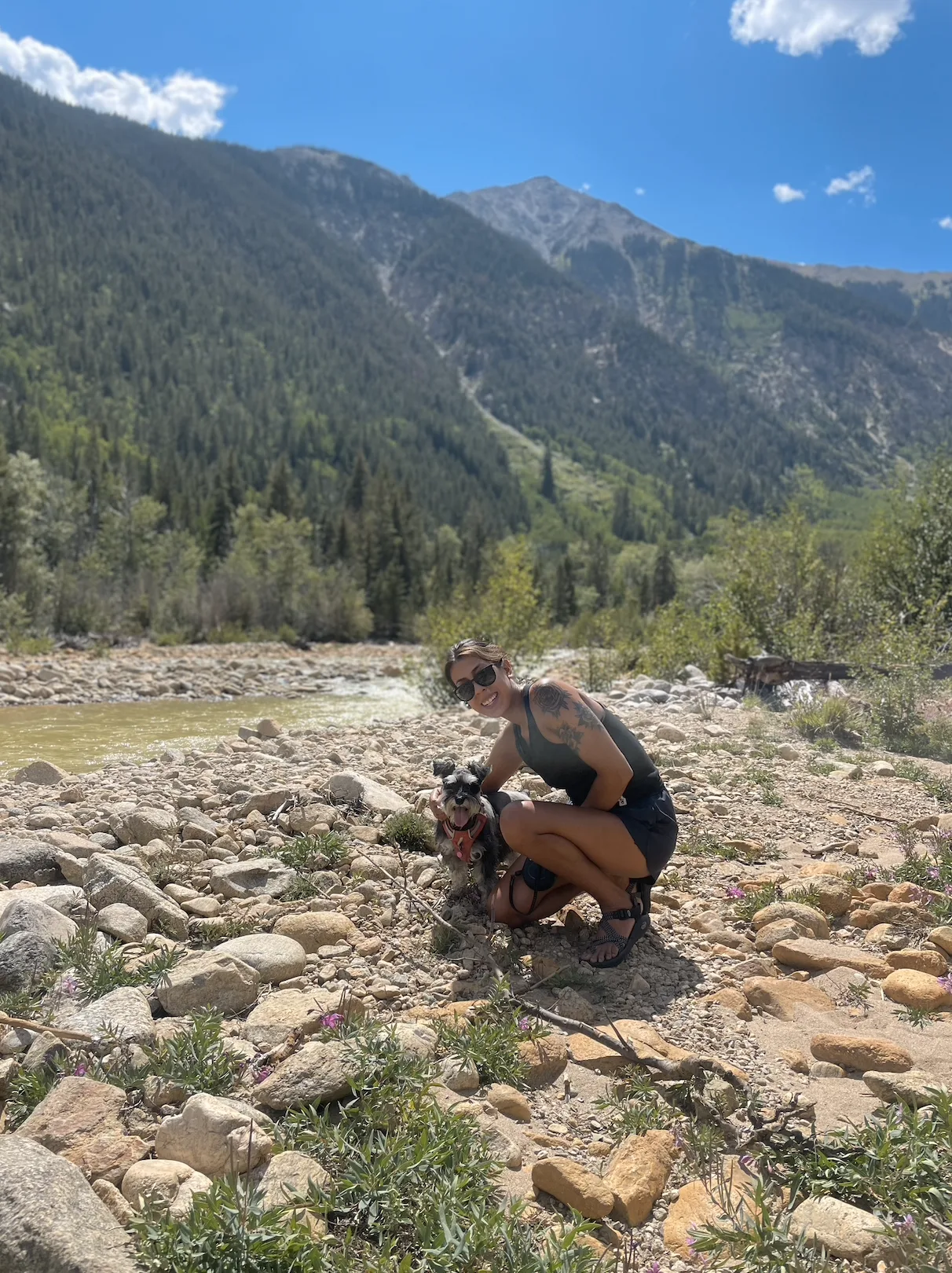 Marlene with Mia beside a mountain river
